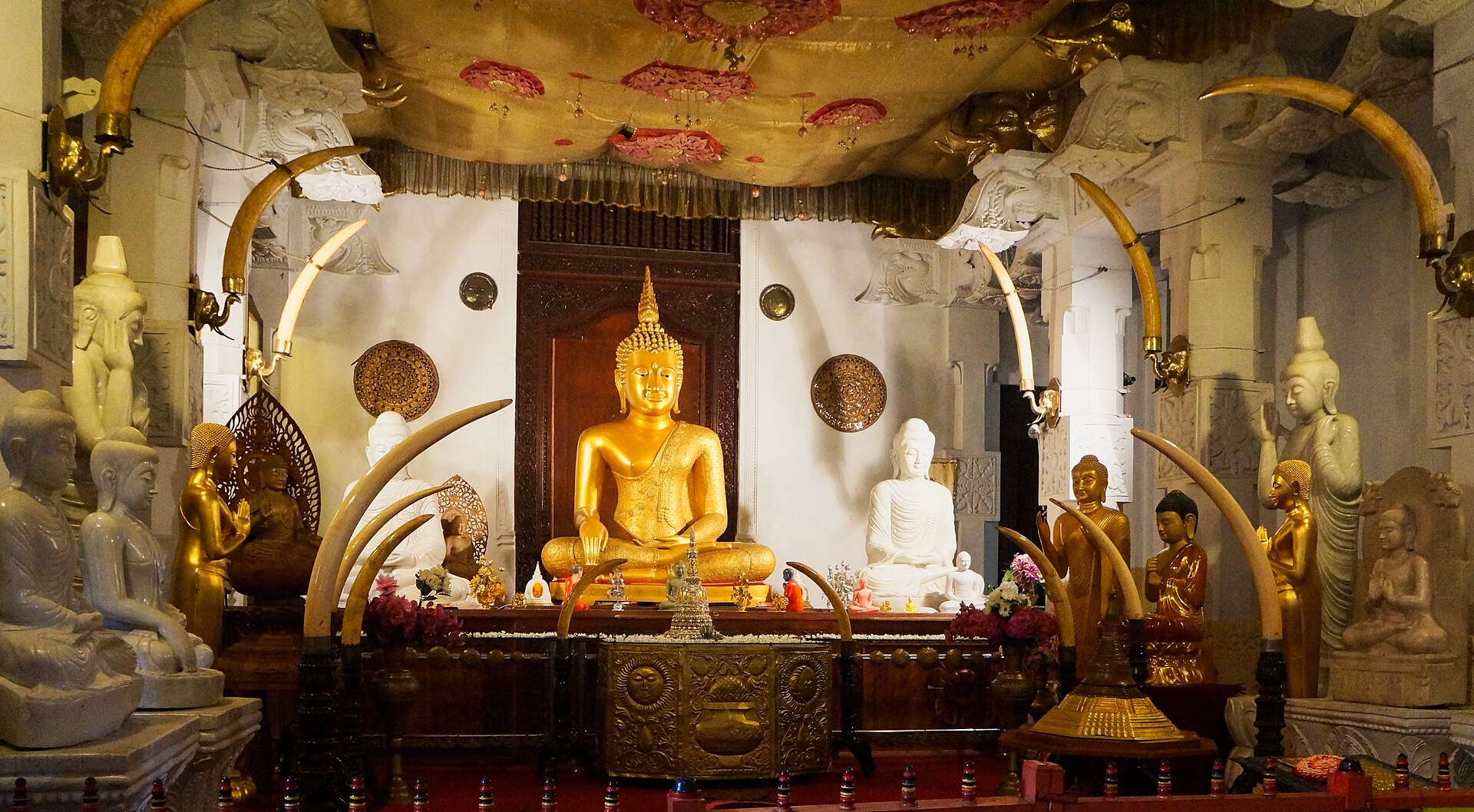 Reclining Buddha statues inside the Temple of the Sacred Tooth Relic in Kandy