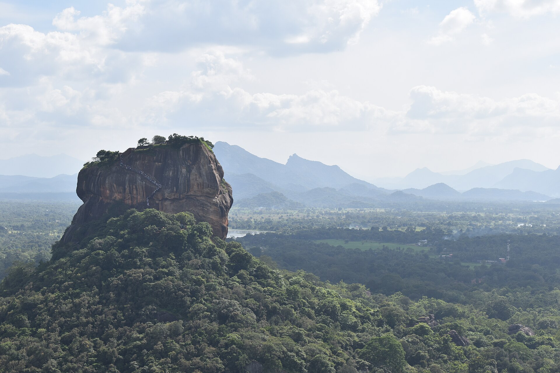 Sigiriya Rock Fortress rising above the jungle canopy, viewed from Pidurangala Rock